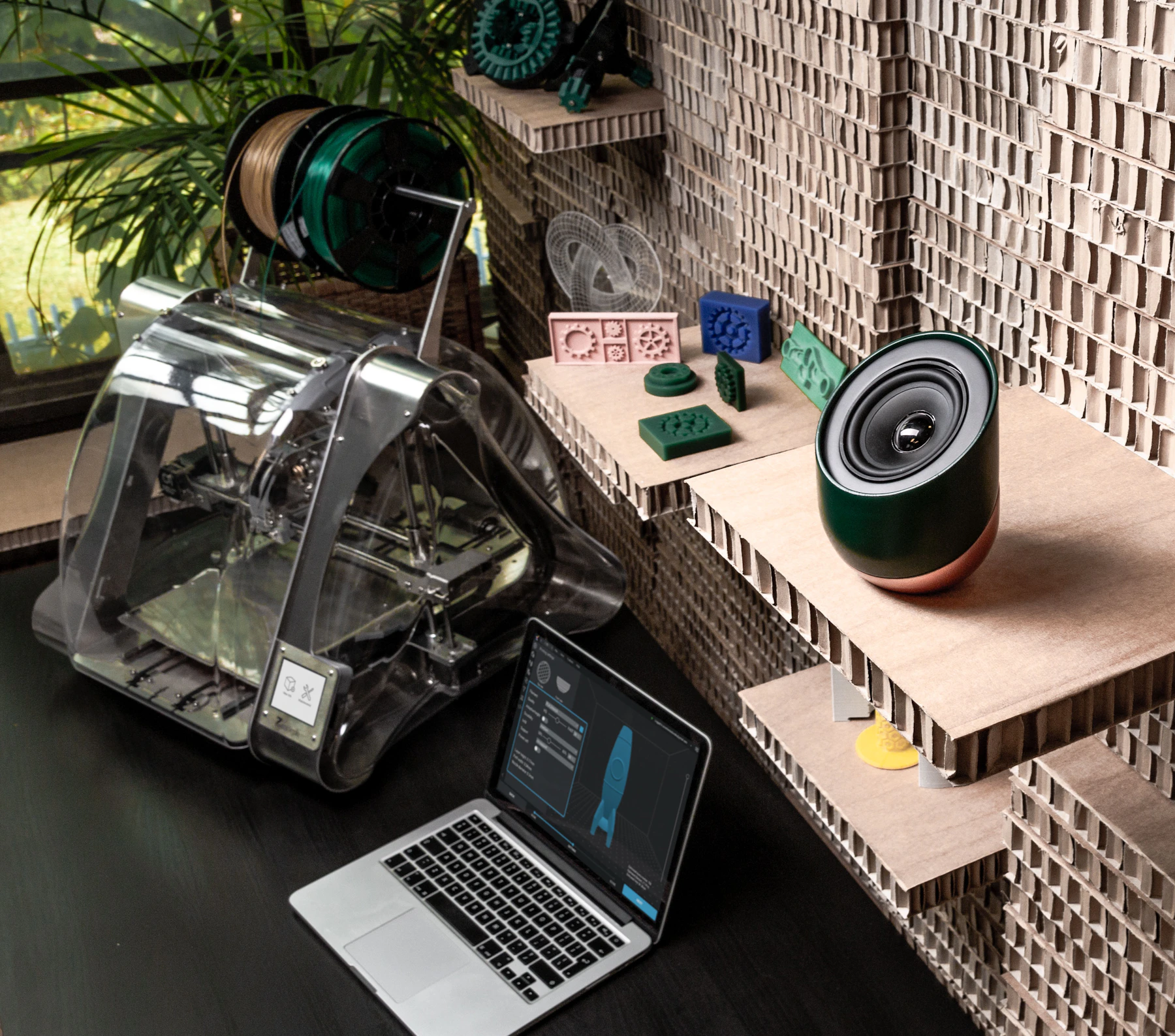 Real ZMorph printer, laptop and fabricated objects in a workspace